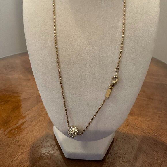 This necklace is a gold-tone with a rhinestone ball pendant. - Picture 5 of 7